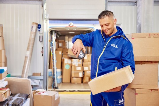 GLS driver scanning parcels
